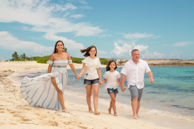 Family walking on the beach in barbados