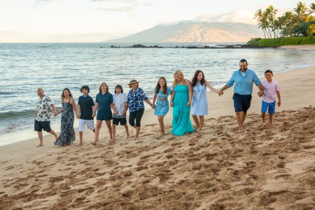 Family walking on the beach in Hawaii